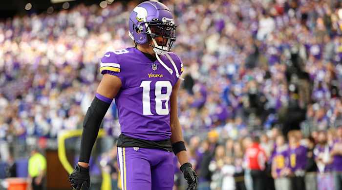 Minnesota Vikings wide receiver Justin Jefferson stands on the field
